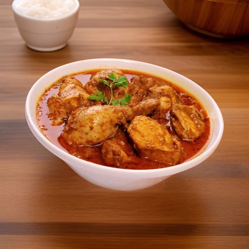 Traditional spicy chicken chili with beans, served in a rustic bowl
